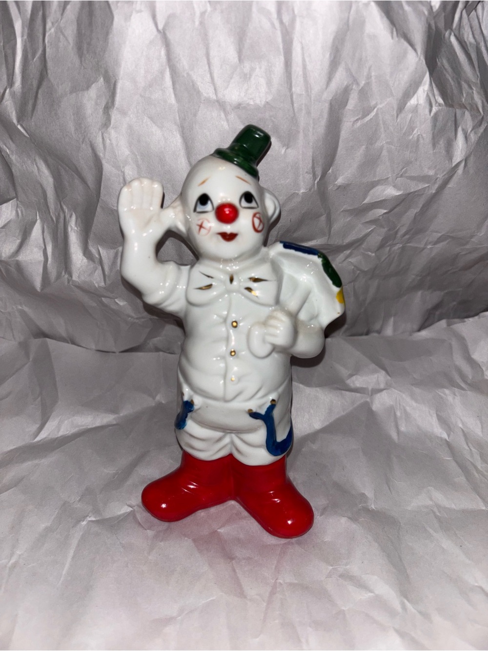 White Ceramic Clown Figurine with Red Boots and Green Hat